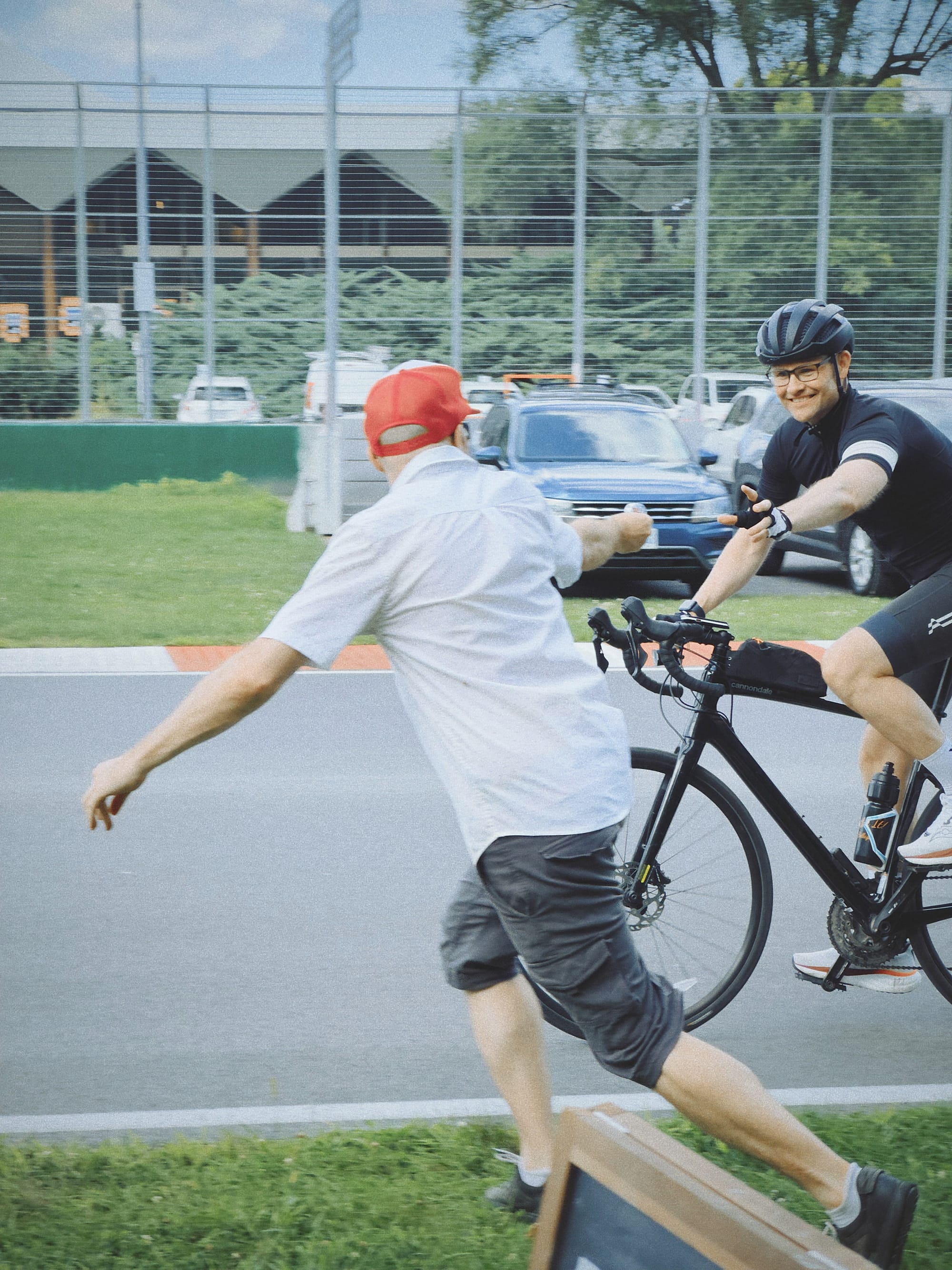 Picture of a beef jerky handoff to Andy at the GP du GP