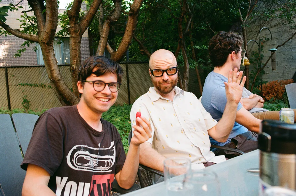 Friends around a garden table at a past Canadian Civil celebration